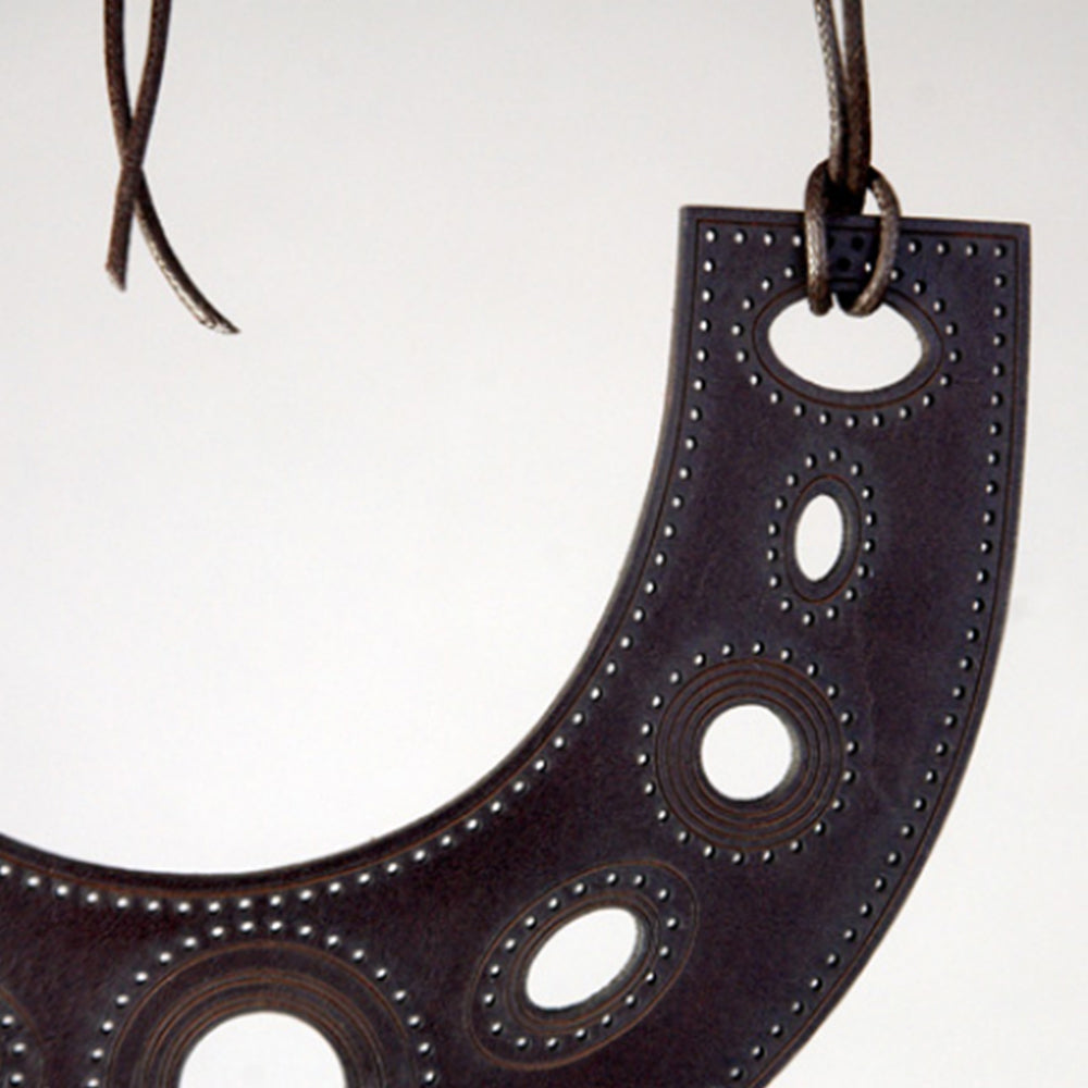 
                  
                    pierced and engraved neckplate by antonia robinson
                  
                