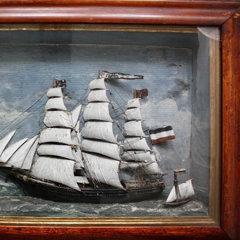 
                  
                    " freda " an antique folk art sailor made diorama .
                  
                