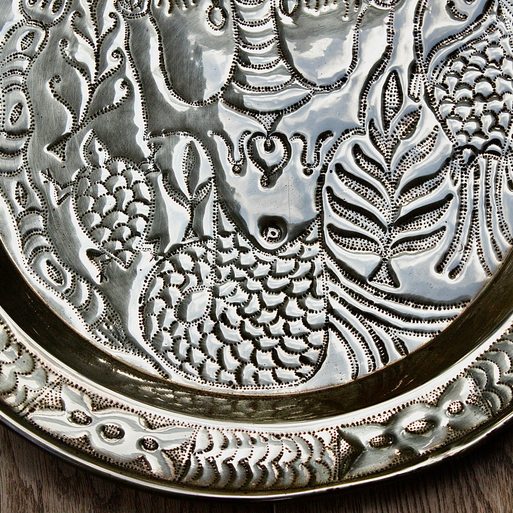 
                  
                    an african efic charger depicting mami wata.
                  
                