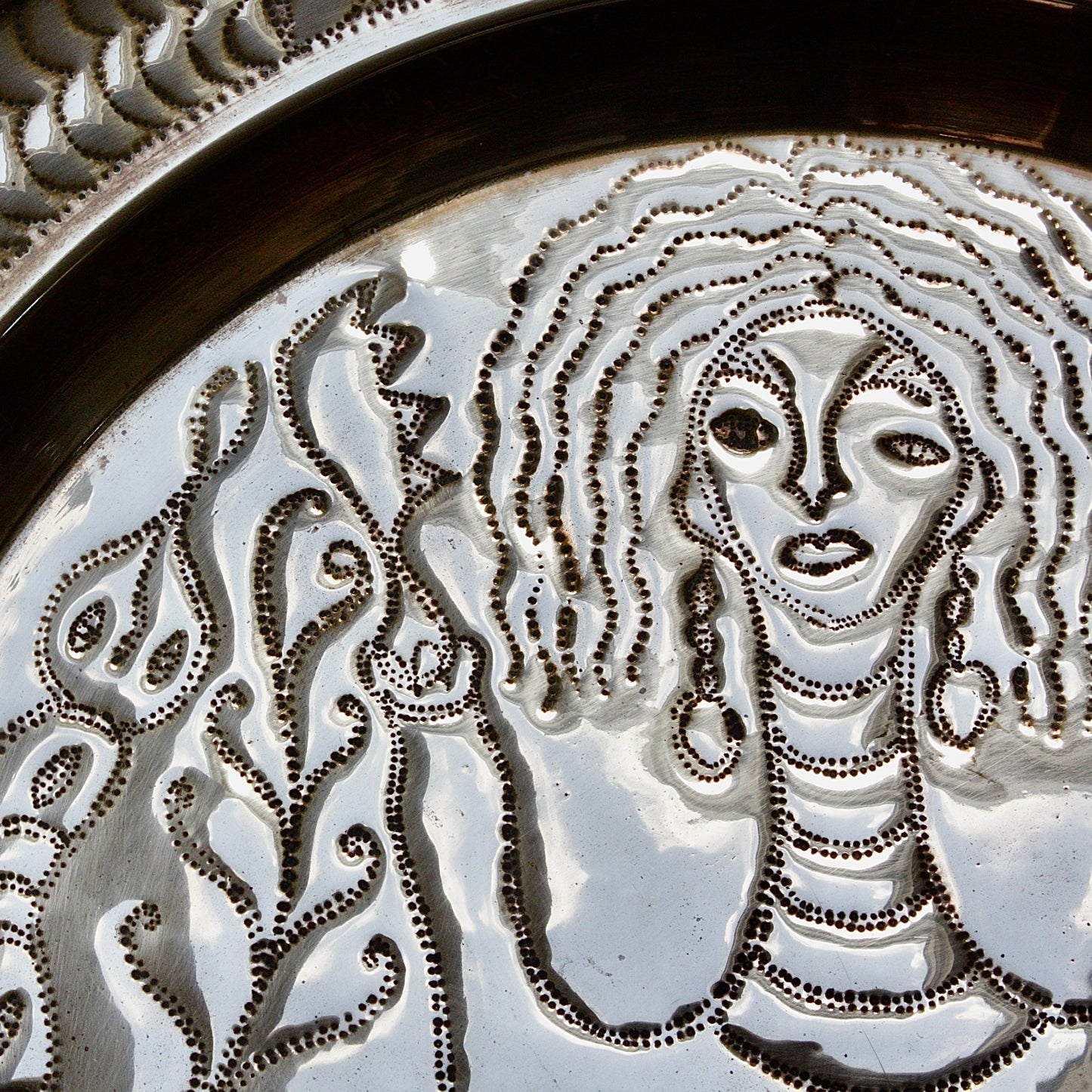 
                  
                    an african efic charger depicting mami wata.
                  
                