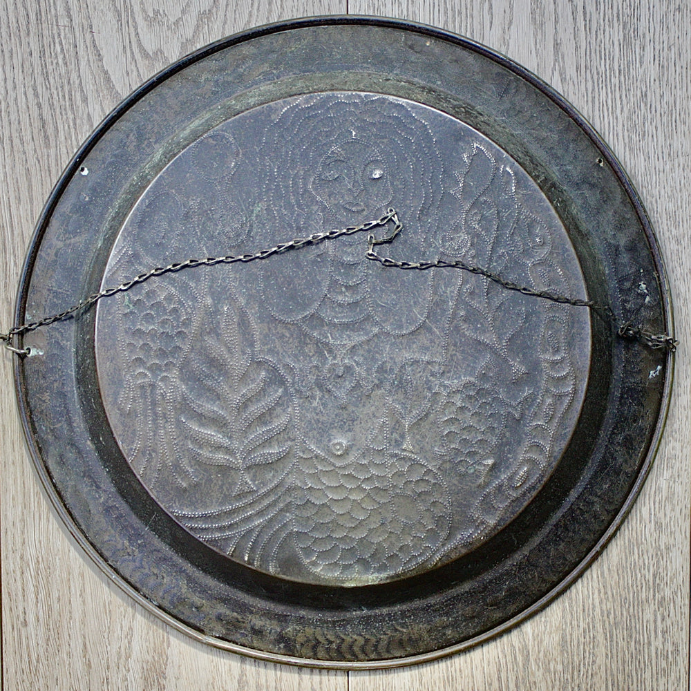 
                  
                    an african efic charger depicting mami wata.
                  
                