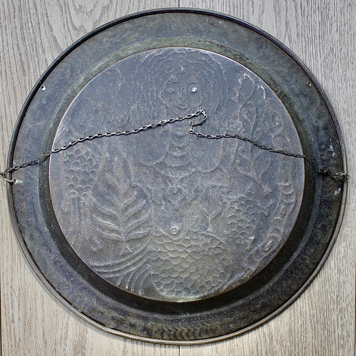
                  
                    an african efic charger depicting mami wata.
                  
                