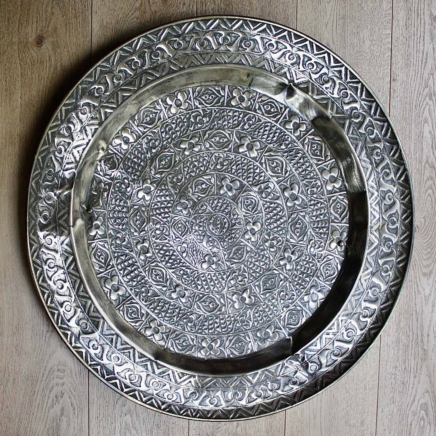 
                  
                    a magnificent huge decorated brass efic brass charger
                  
                
