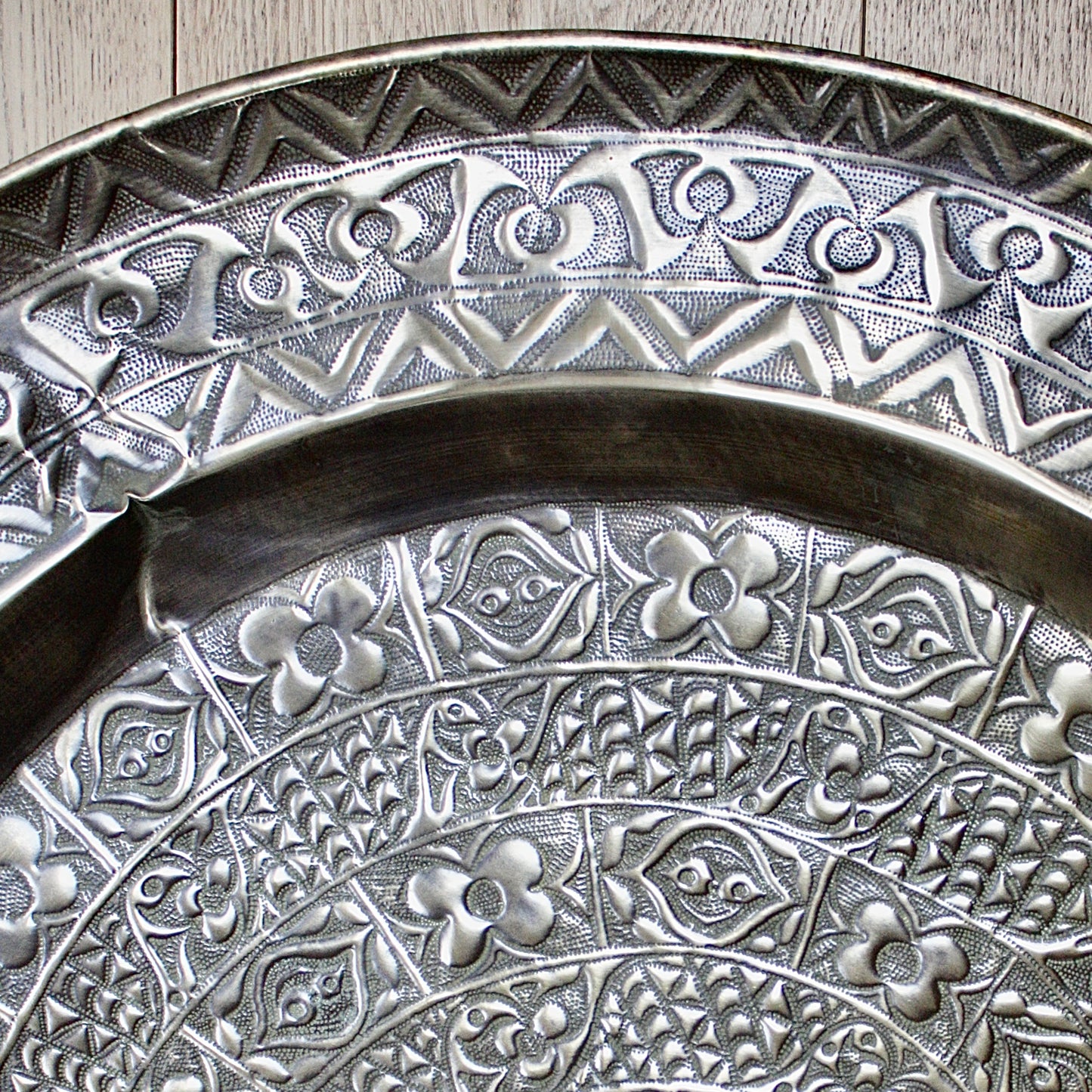 
                  
                    a magnificent huge decorated brass efic brass charger
                  
                
