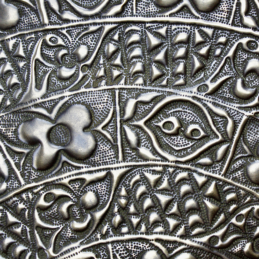 
                  
                    a magnificent huge decorated brass efic brass charger
                  
                