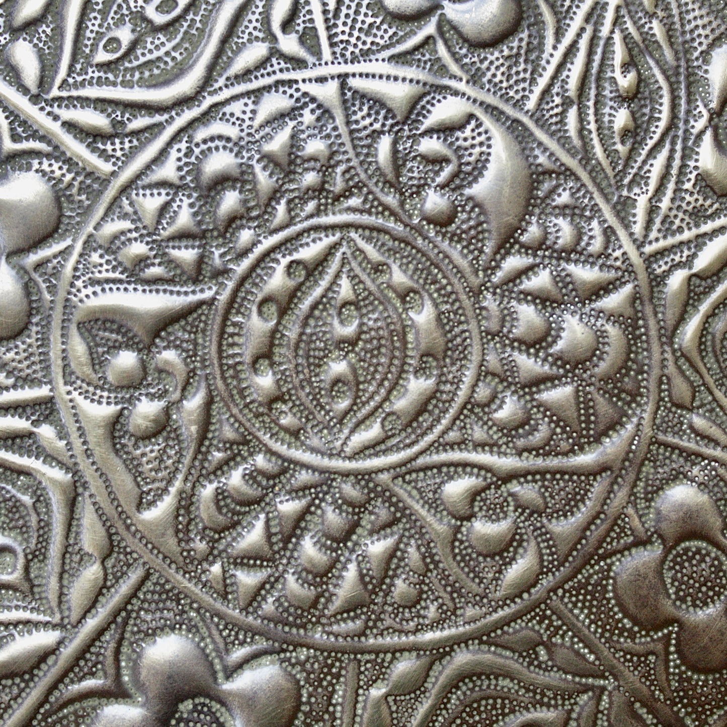 
                  
                    a magnificent huge decorated brass efic brass charger
                  
                