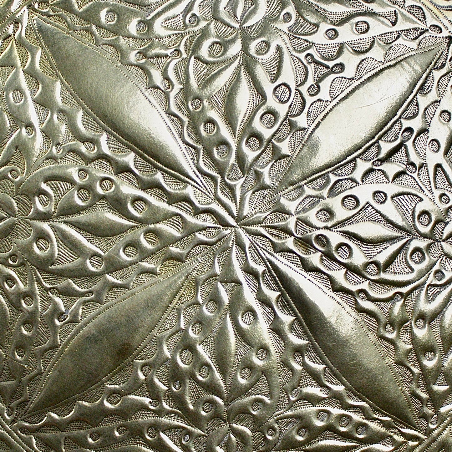 
                  
                    a 710mm diameter antique brass embossed charger from old calabar
                  
                