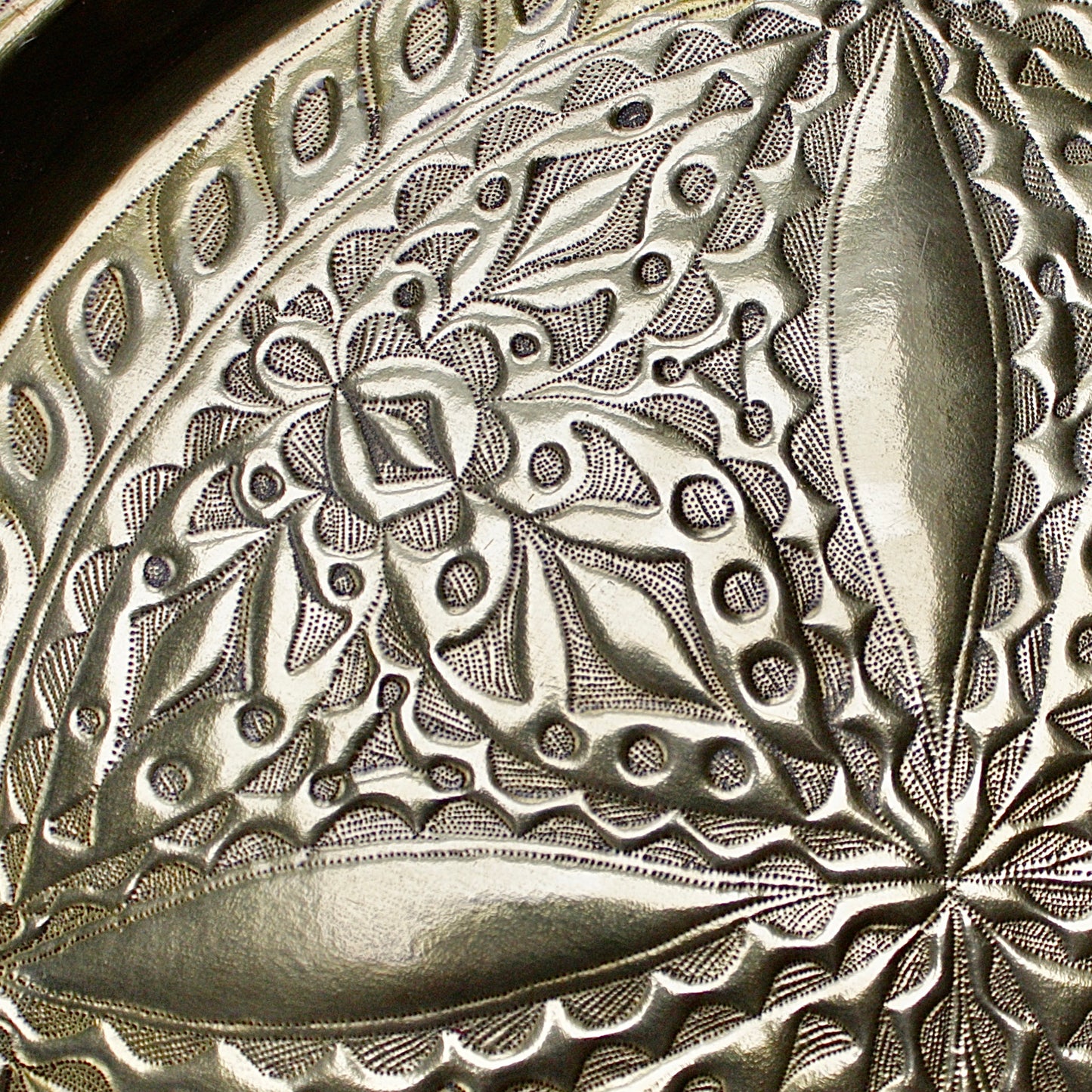 
                  
                    a 710mm diameter antique brass embossed charger from old calabar
                  
                