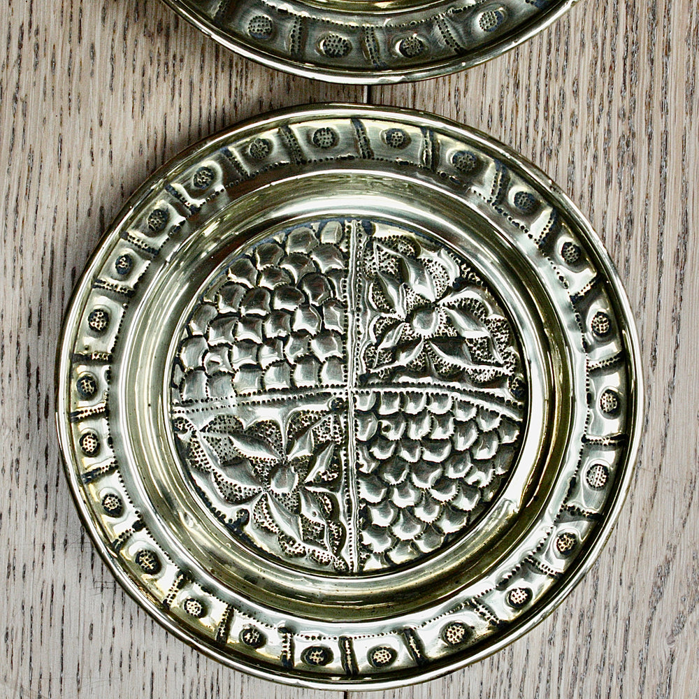 
                  
                    a pair of small embossed brass dishes from old calabar.
                  
                