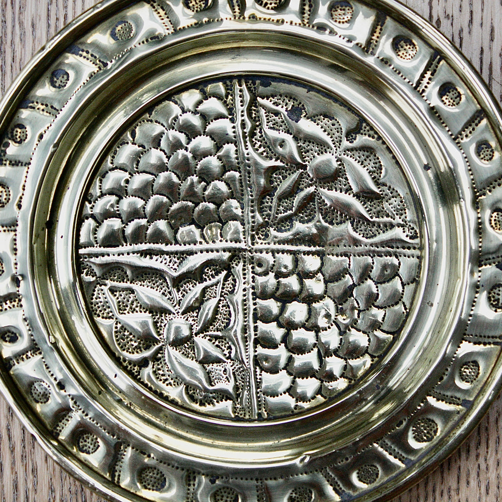 
                  
                    a pair of small embossed brass dishes from old calabar.
                  
                