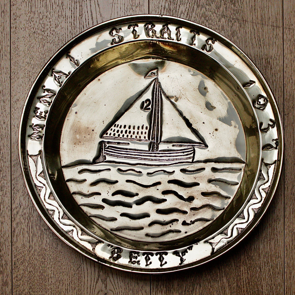 a commissioned brass charger from old calabar of the 