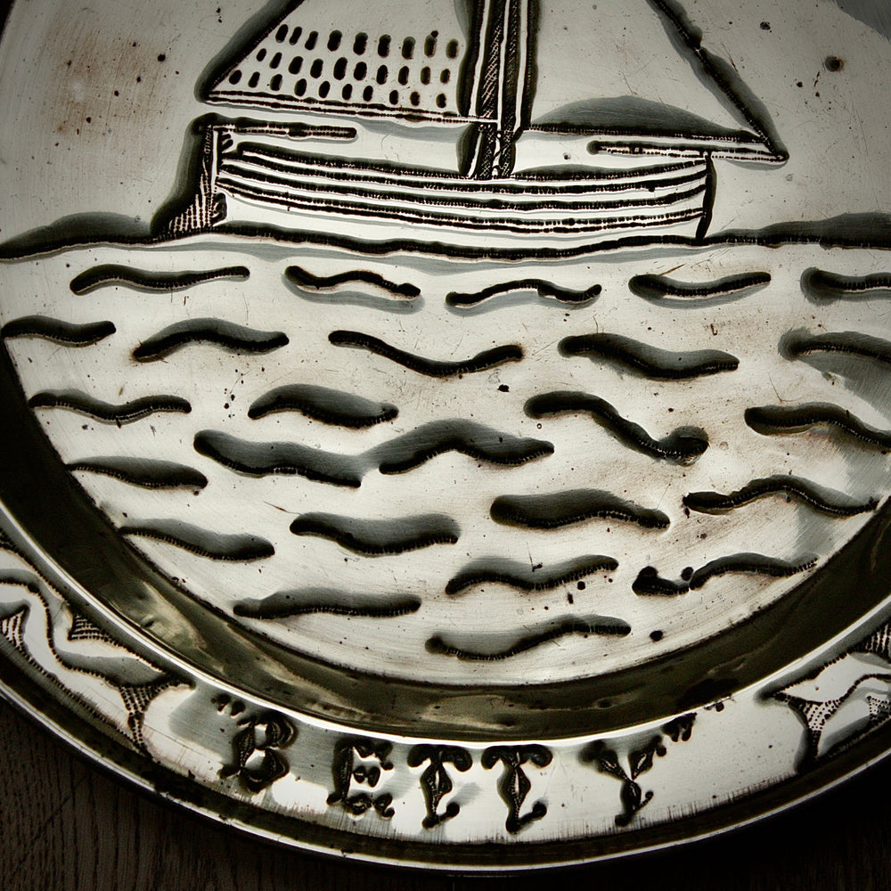 
                  
                    a commissioned brass charger from old calabar of the "betty"
                  
                