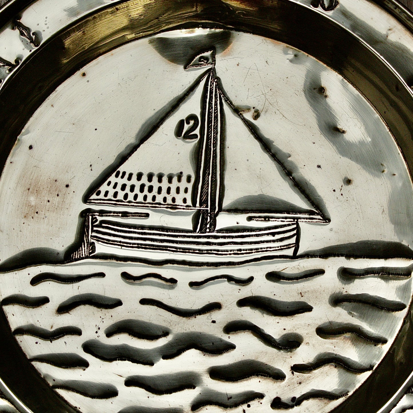 
                  
                    a commissioned brass charger from old calabar of the "betty"
                  
                