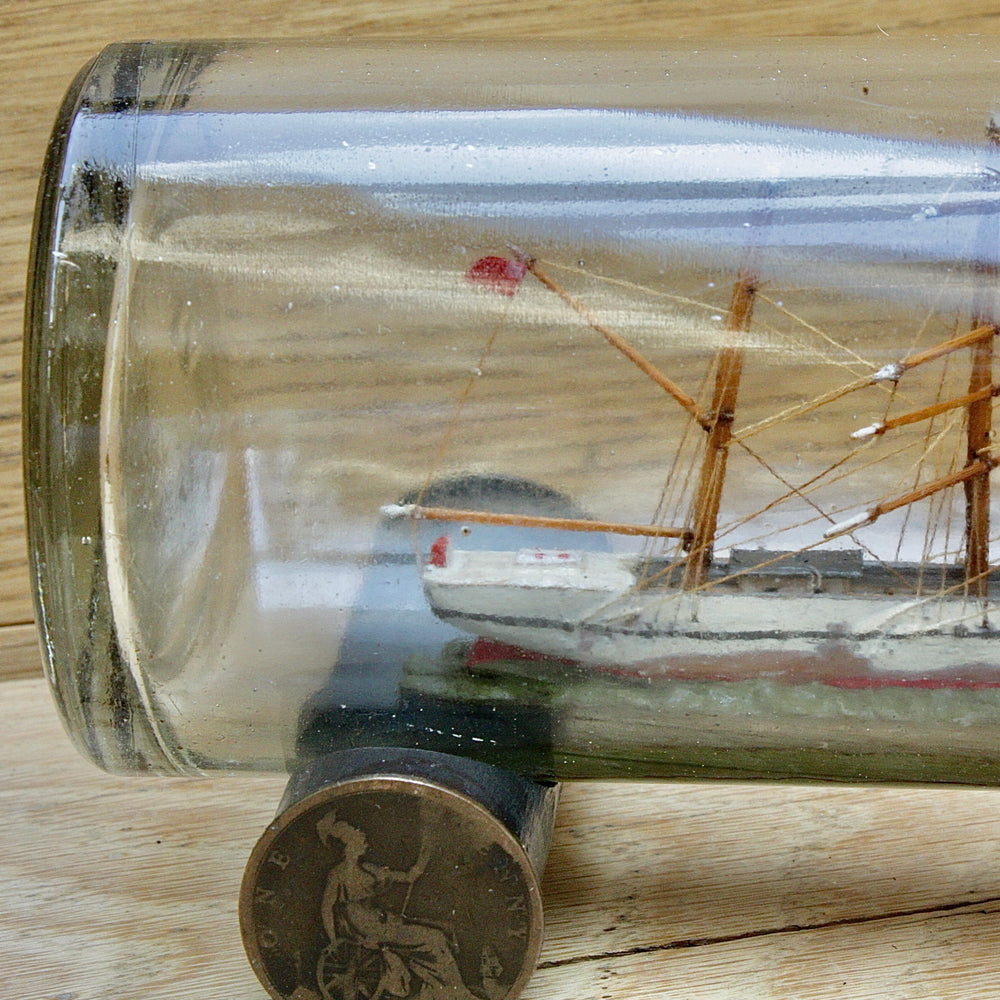 
                  
                    An early 20th century ship in a bottle.
                  
                