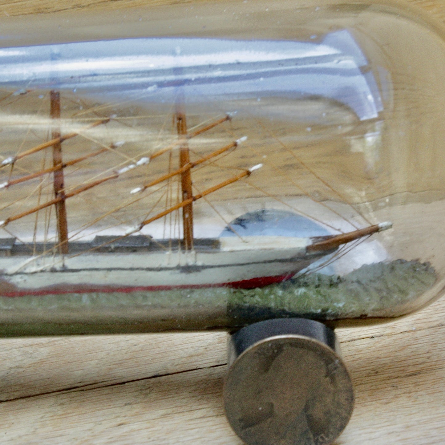 
                  
                    An early 20th century ship in a bottle.
                  
                