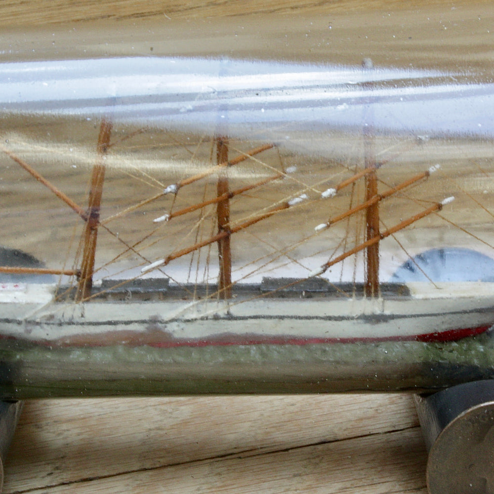 
                  
                    An early 20th century ship in a bottle.
                  
                