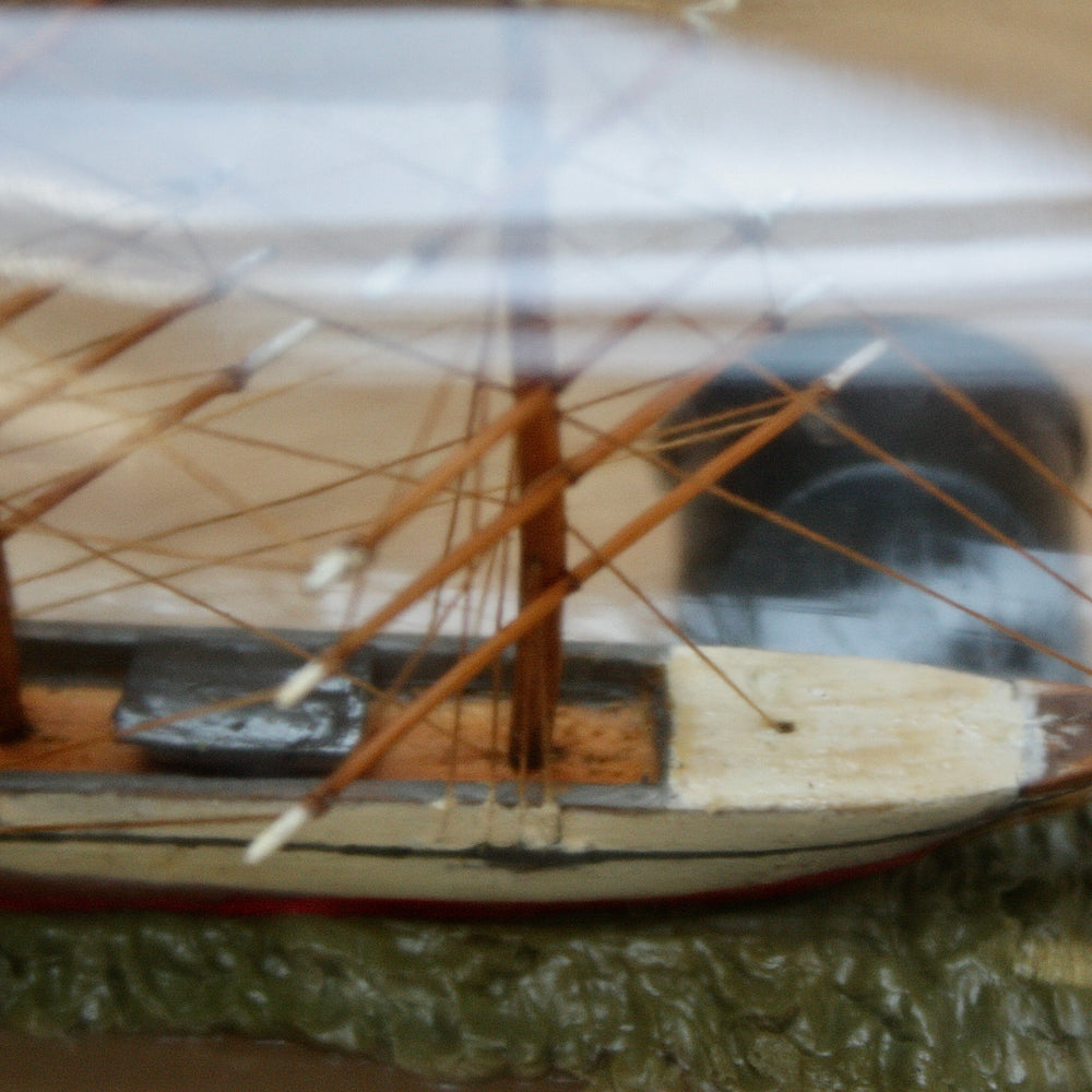 
                  
                    An early 20th century ship in a bottle.
                  
                