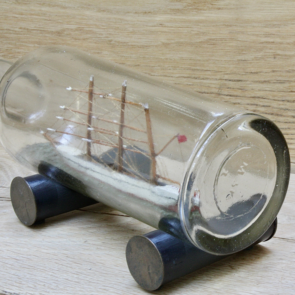 
                  
                    An early 20th century ship in a bottle.
                  
                