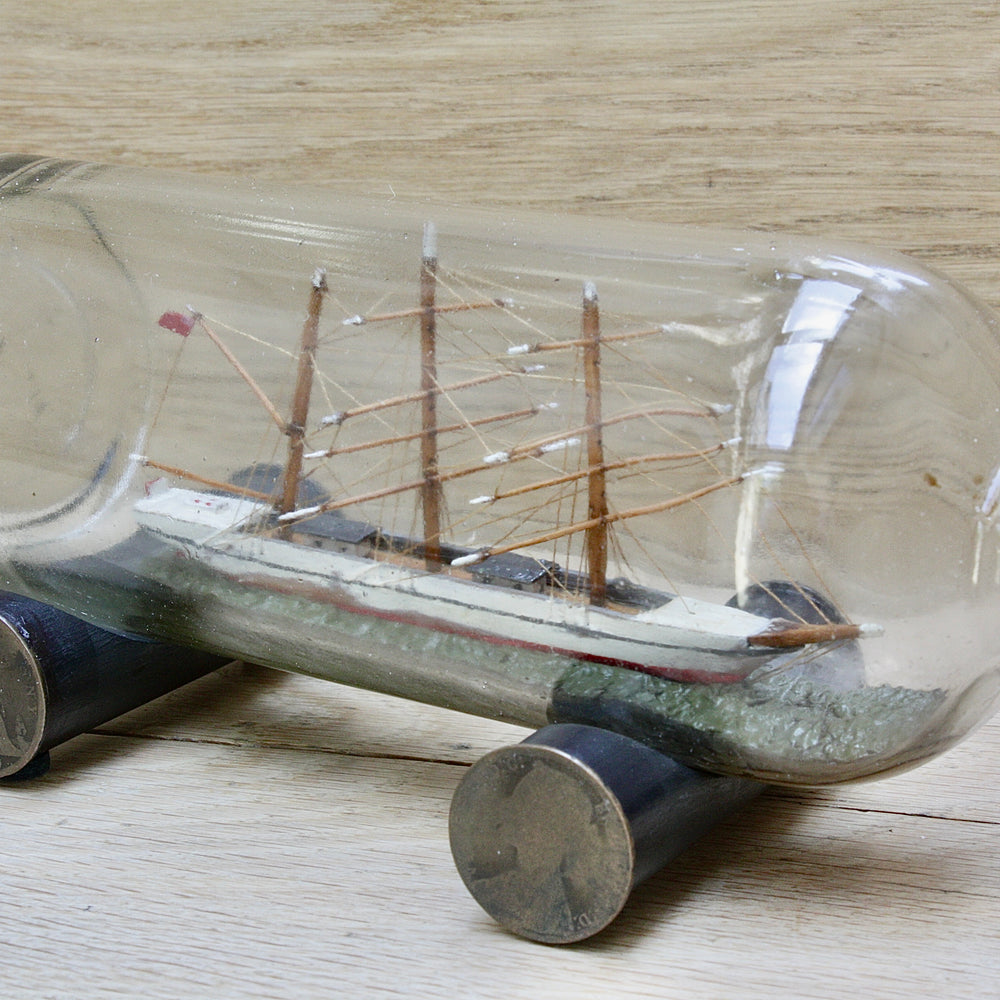 
                  
                    An early 20th century ship in a bottle.
                  
                