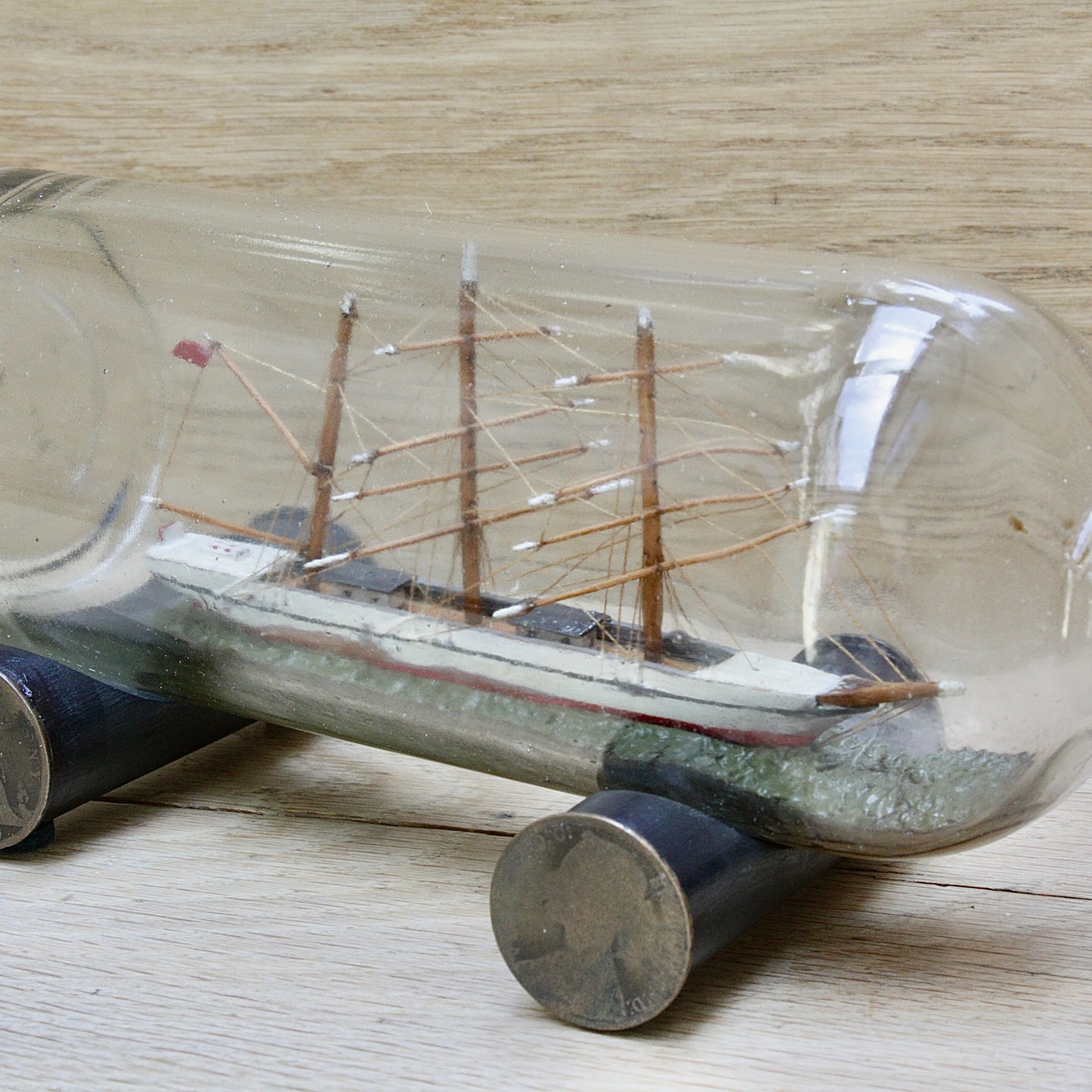 
                  
                    An early 20th century ship in a bottle.
                  
                