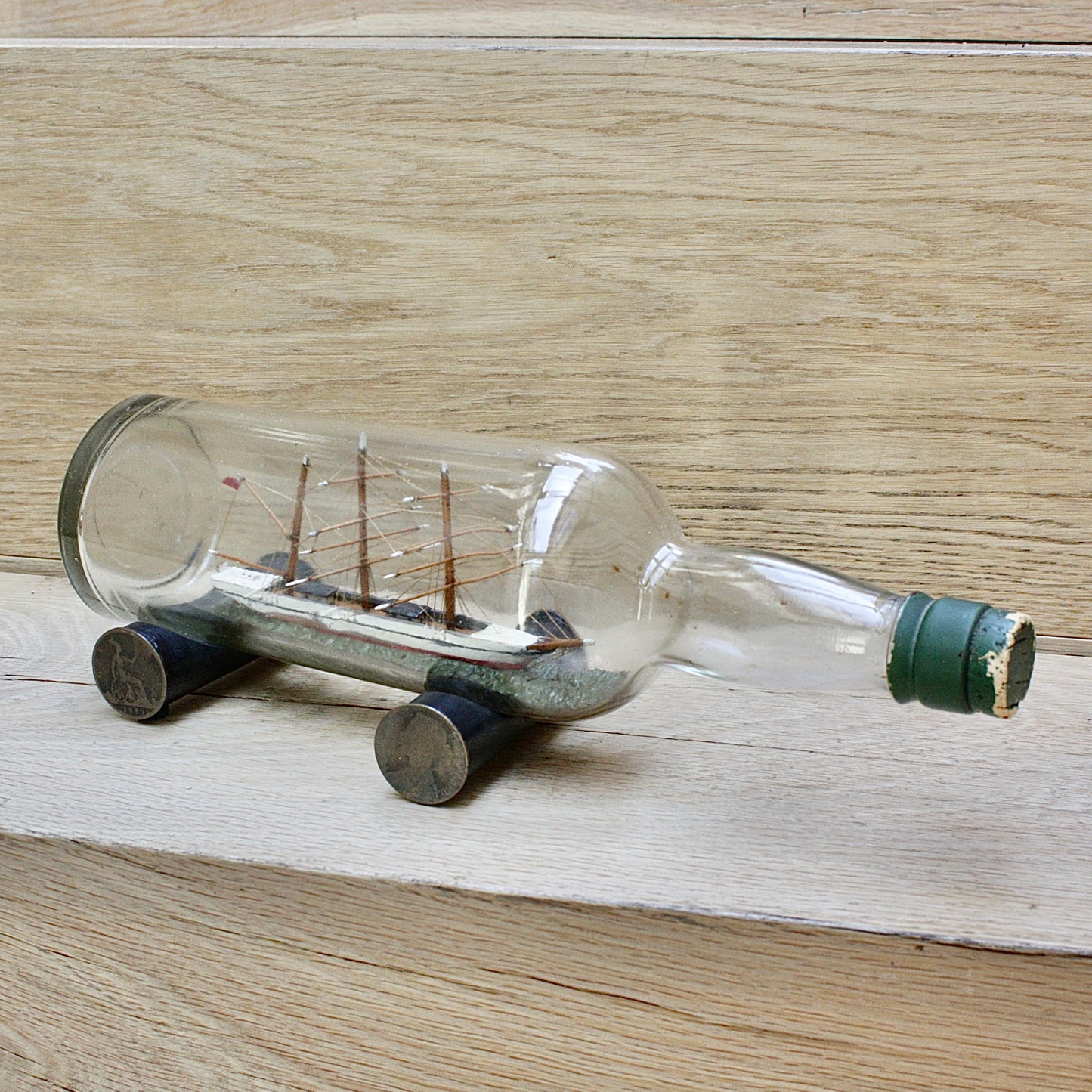 
                  
                    An early 20th century ship in a bottle.
                  
                