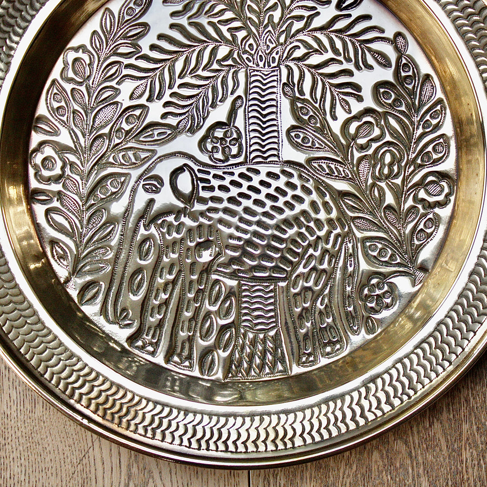 
                  
                    a magnificent african efic brass charger with elephant
                  
                