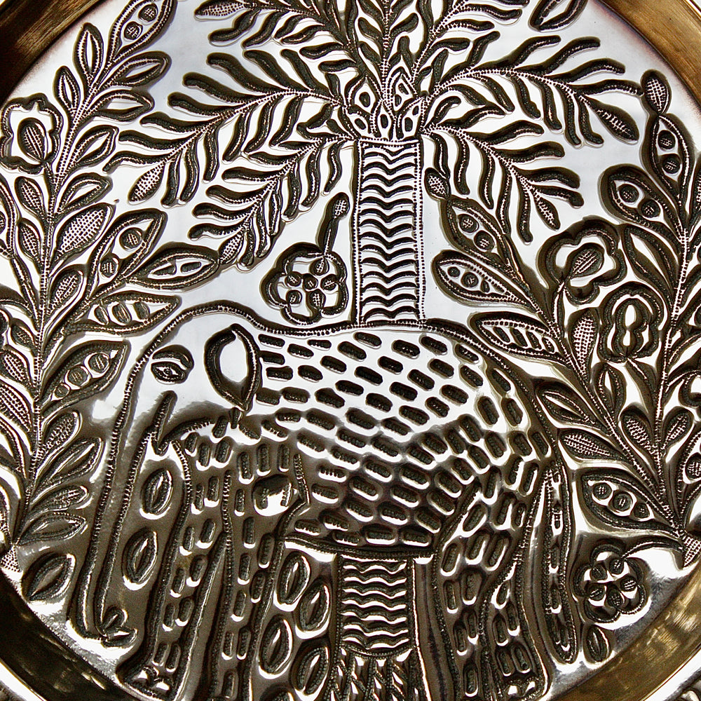 
                  
                    a magnificent african efic brass charger with elephant
                  
                