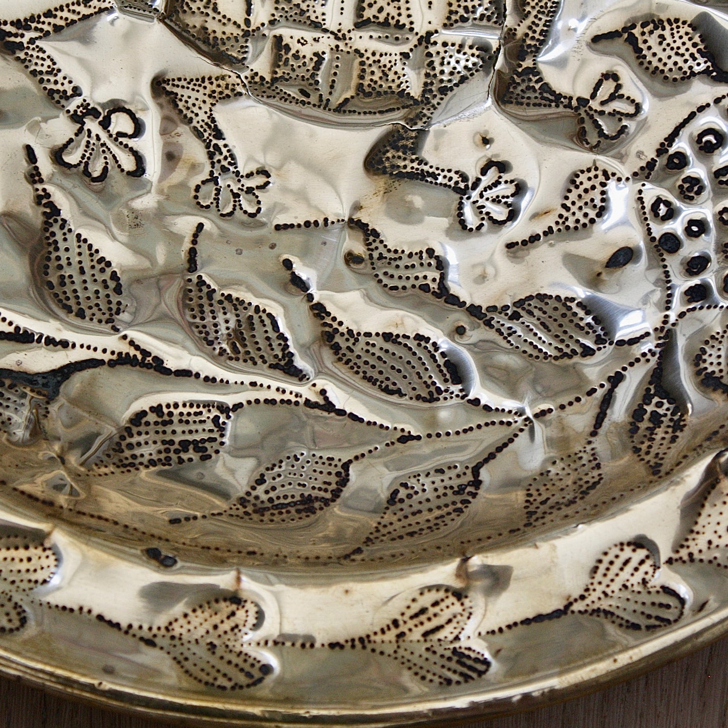 
                  
                    an embossed brass dish depicting " all of you " from old calabar.
                  
                