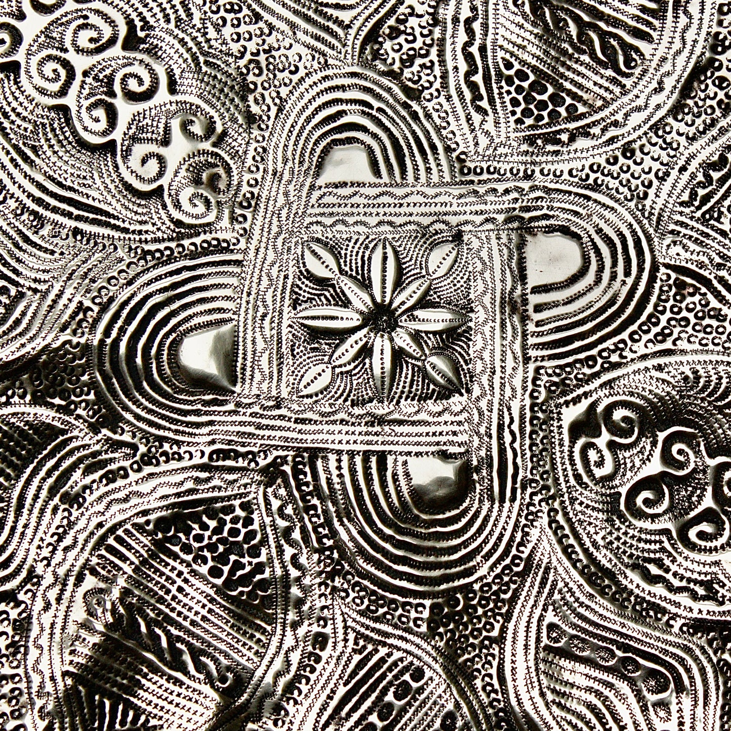 
                  
                    a nigerian embossed charger
                  
                