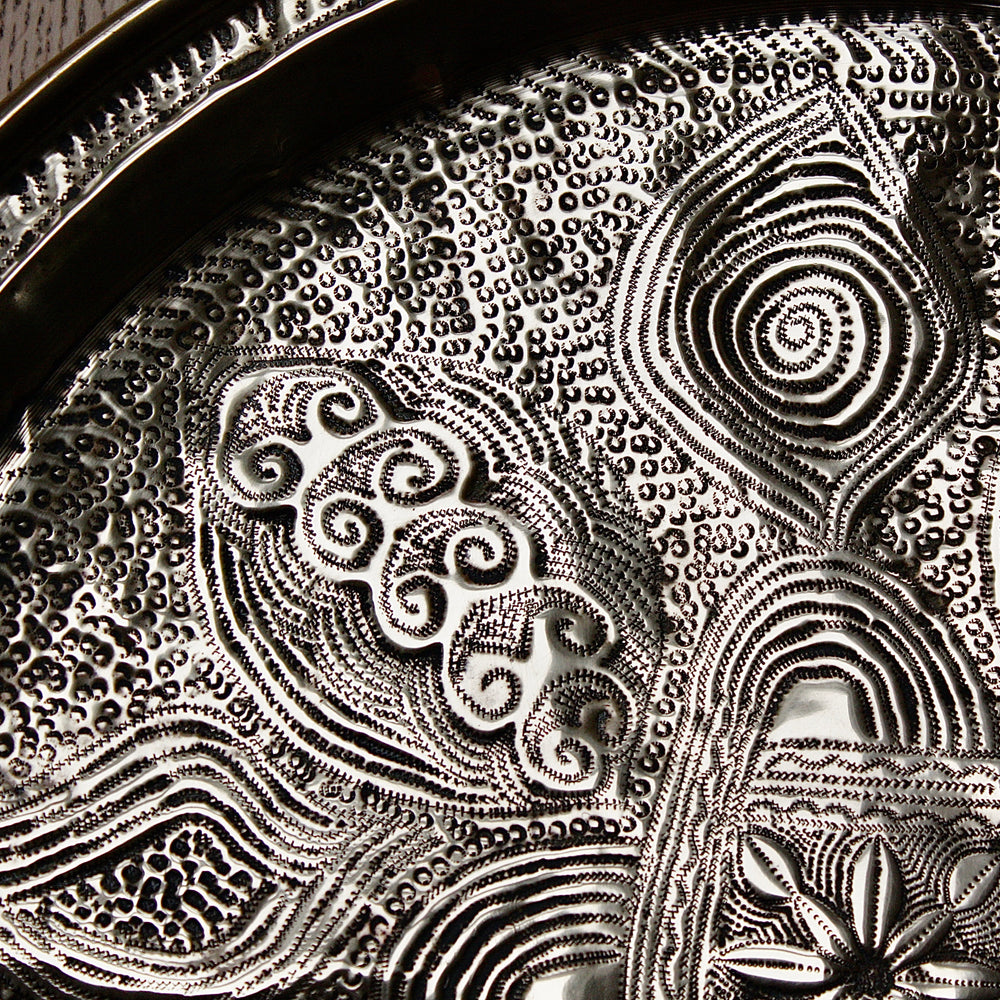 
                  
                    a nigerian embossed charger
                  
                