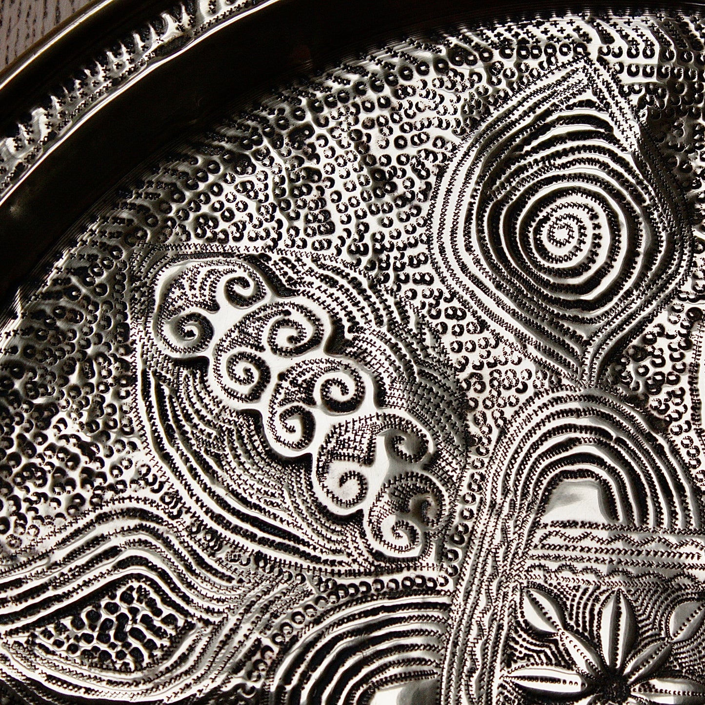 
                  
                    a nigerian embossed charger
                  
                