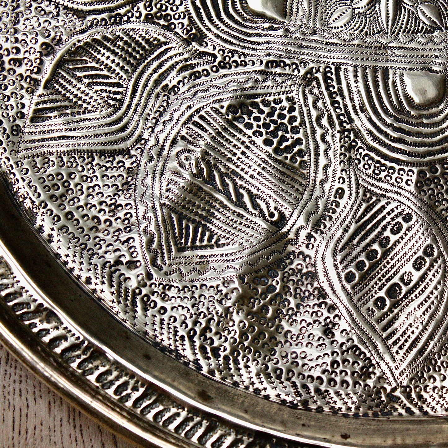
                  
                    a nigerian embossed charger
                  
                