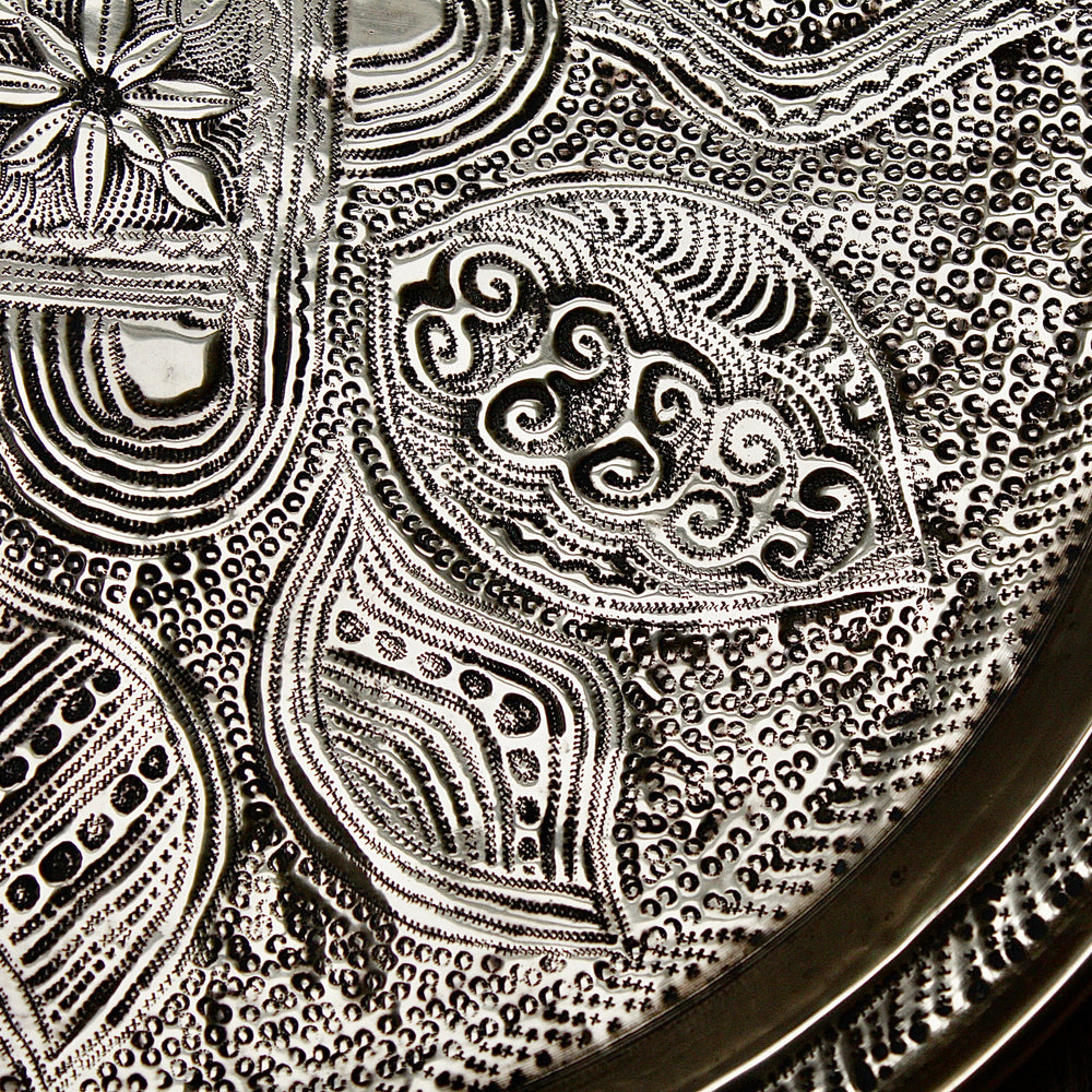 
                  
                    a nigerian embossed charger
                  
                