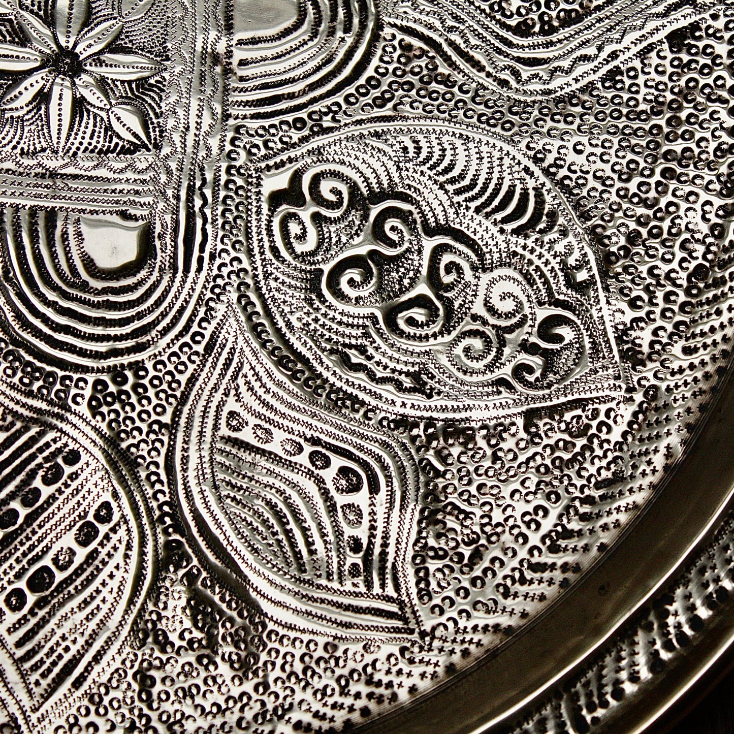 
                  
                    a nigerian embossed charger
                  
                