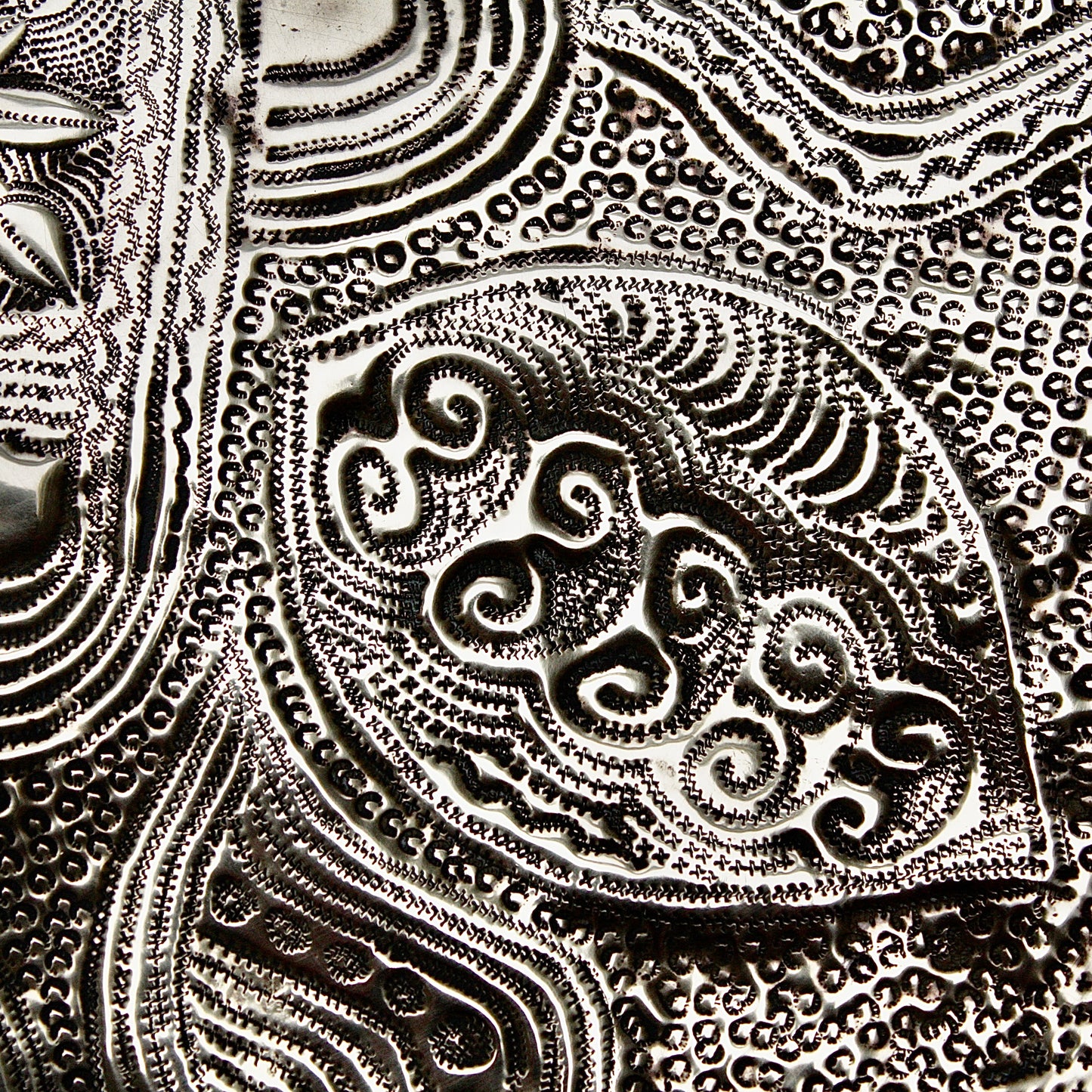 
                  
                    a nigerian embossed charger
                  
                