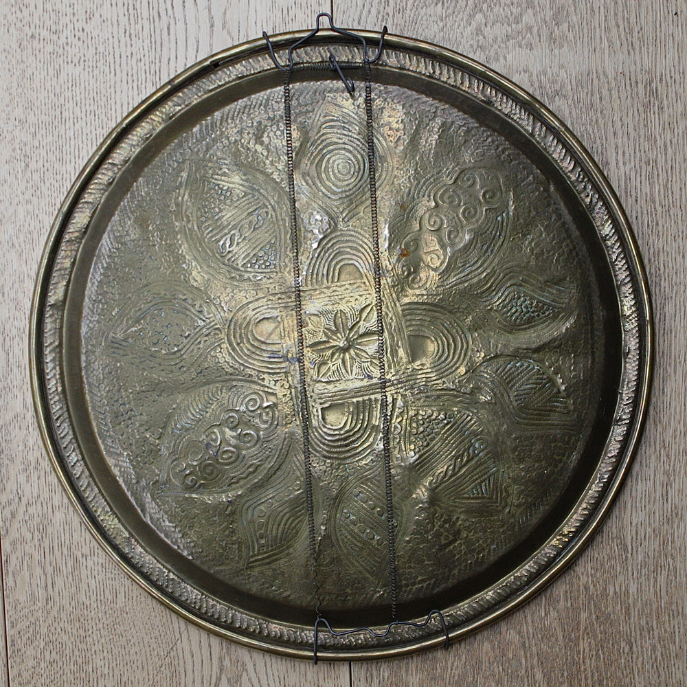 
                  
                    a nigerian embossed charger
                  
                