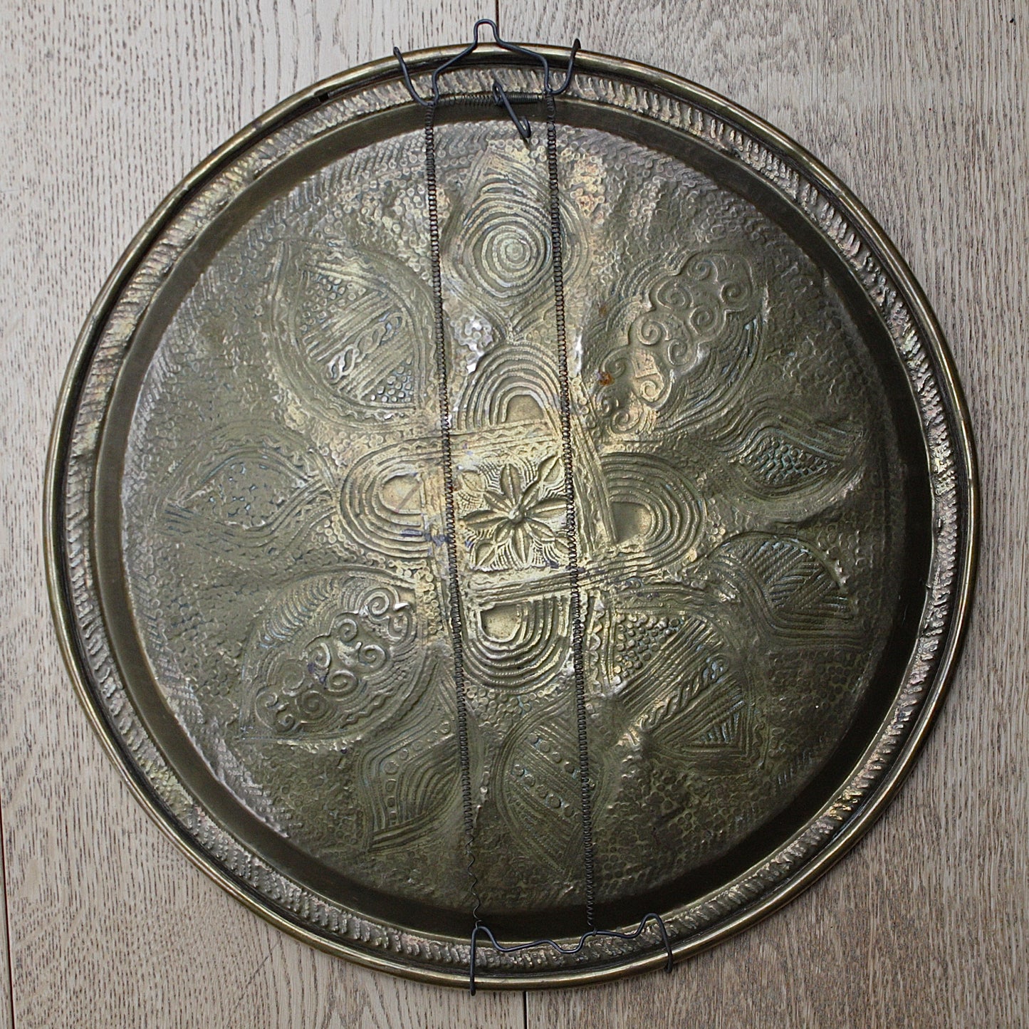 
                  
                    a nigerian embossed charger
                  
                