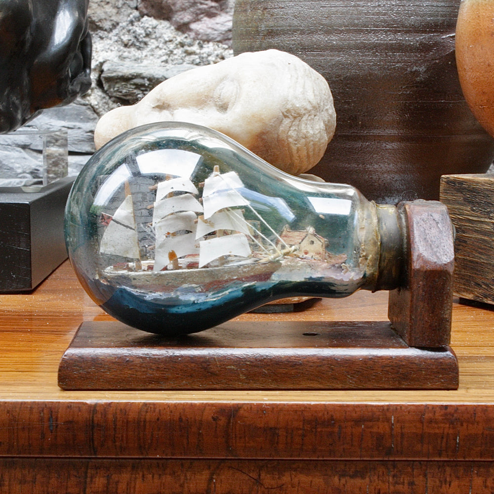 An unusual Folk art ship in a lightbulb.