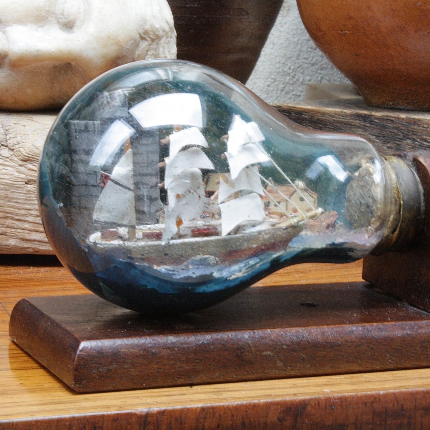 
                  
                    An unusual Folk art ship in a lightbulb.
                  
                