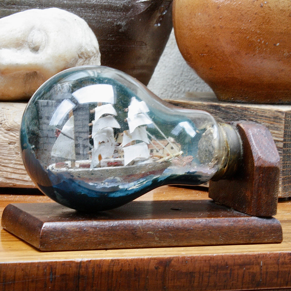 
                  
                    An unusual Folk art ship in a lightbulb.
                  
                