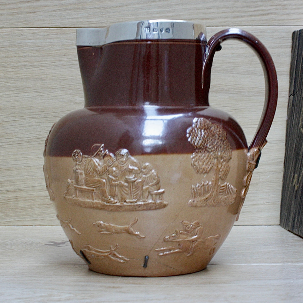 
                  
                    a splendid staple and rivet repaired doulton of lambeth "harvest" jug
                  
                