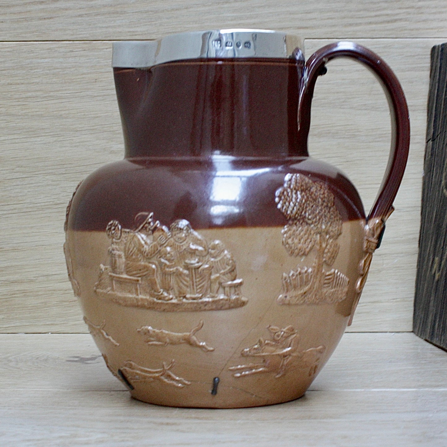 
                  
                    a splendid staple and rivet repaired doulton of lambeth "harvest" jug
                  
                