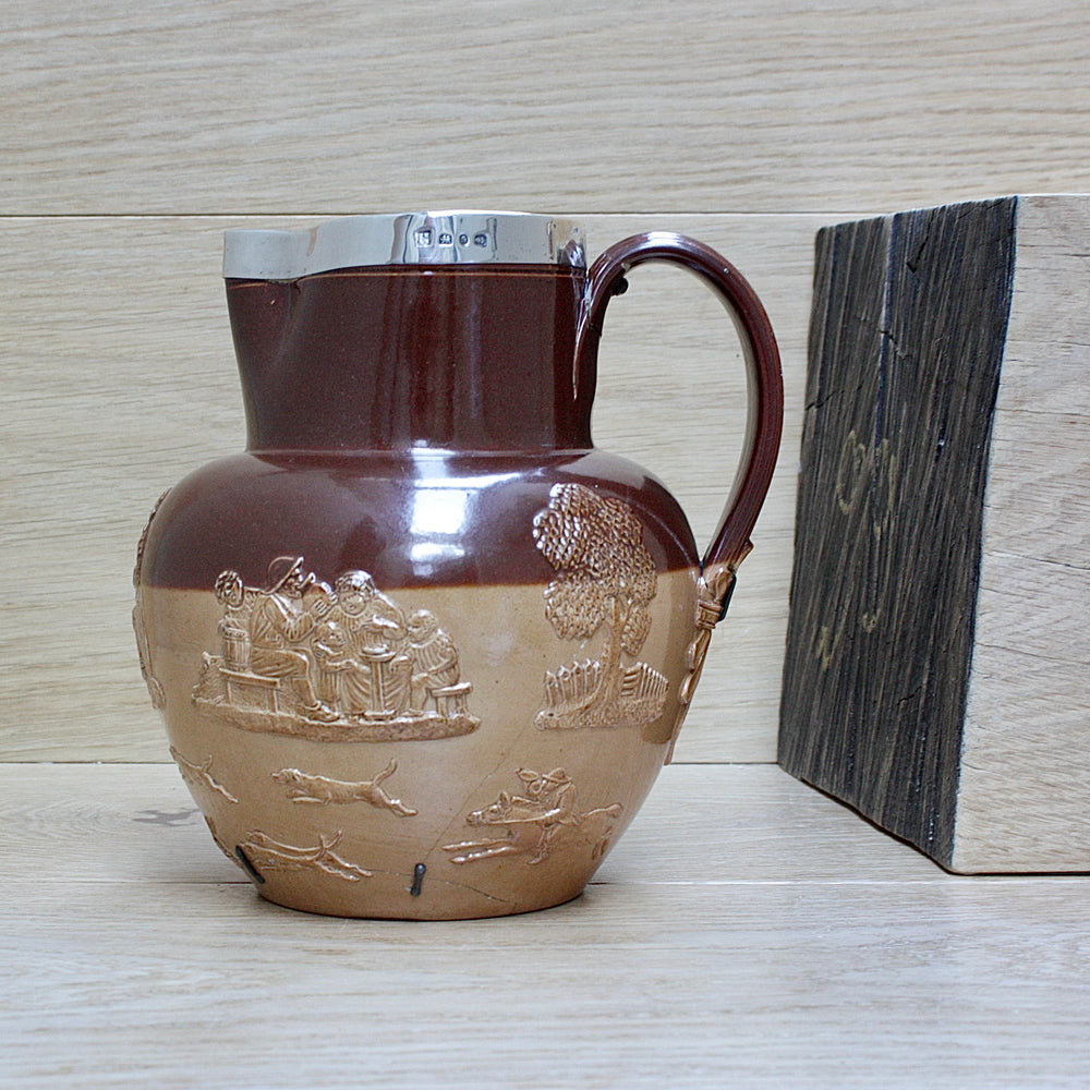 
                  
                    a splendid staple and rivet repaired doulton of lambeth "harvest" jug
                  
                