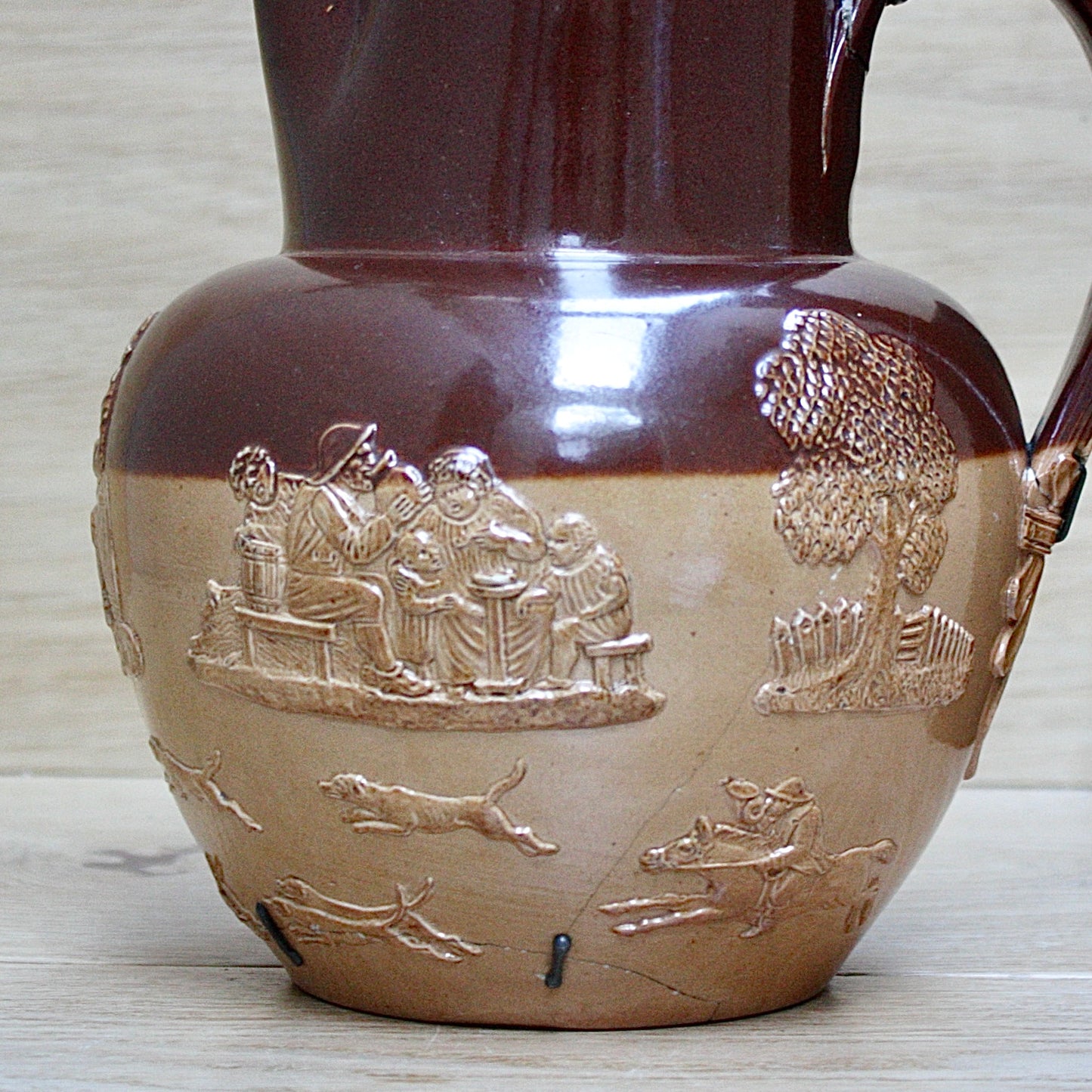 
                  
                    a splendid staple and rivet repaired doulton of lambeth "harvest" jug
                  
                