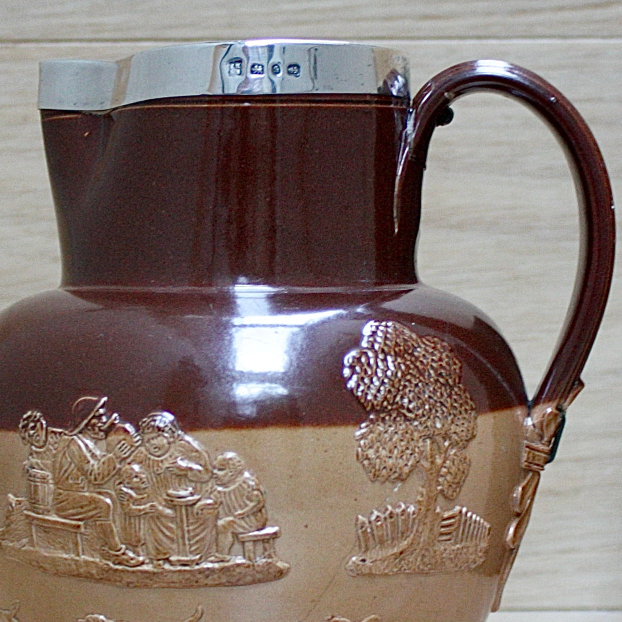 
                  
                    a splendid staple and rivet repaired doulton of lambeth "harvest" jug
                  
                