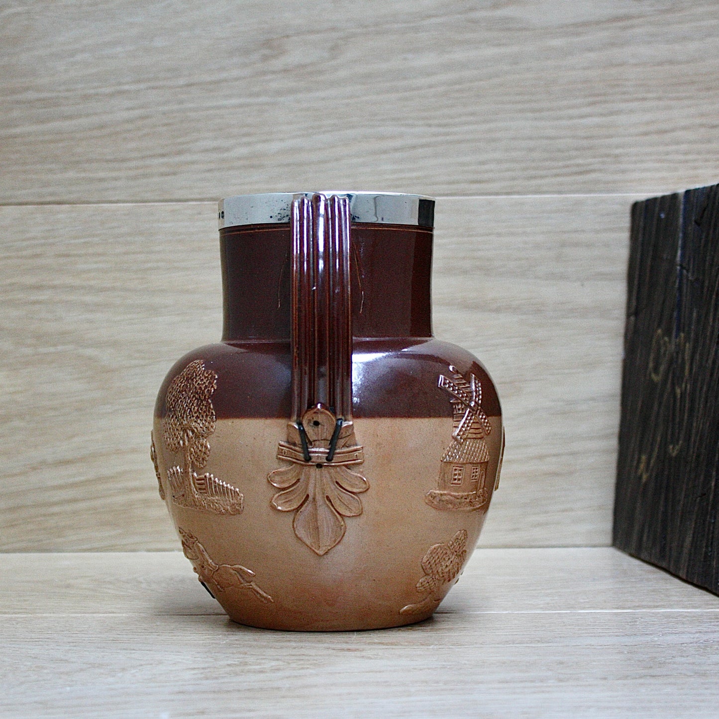 
                  
                    a splendid staple and rivet repaired doulton of lambeth "harvest" jug
                  
                