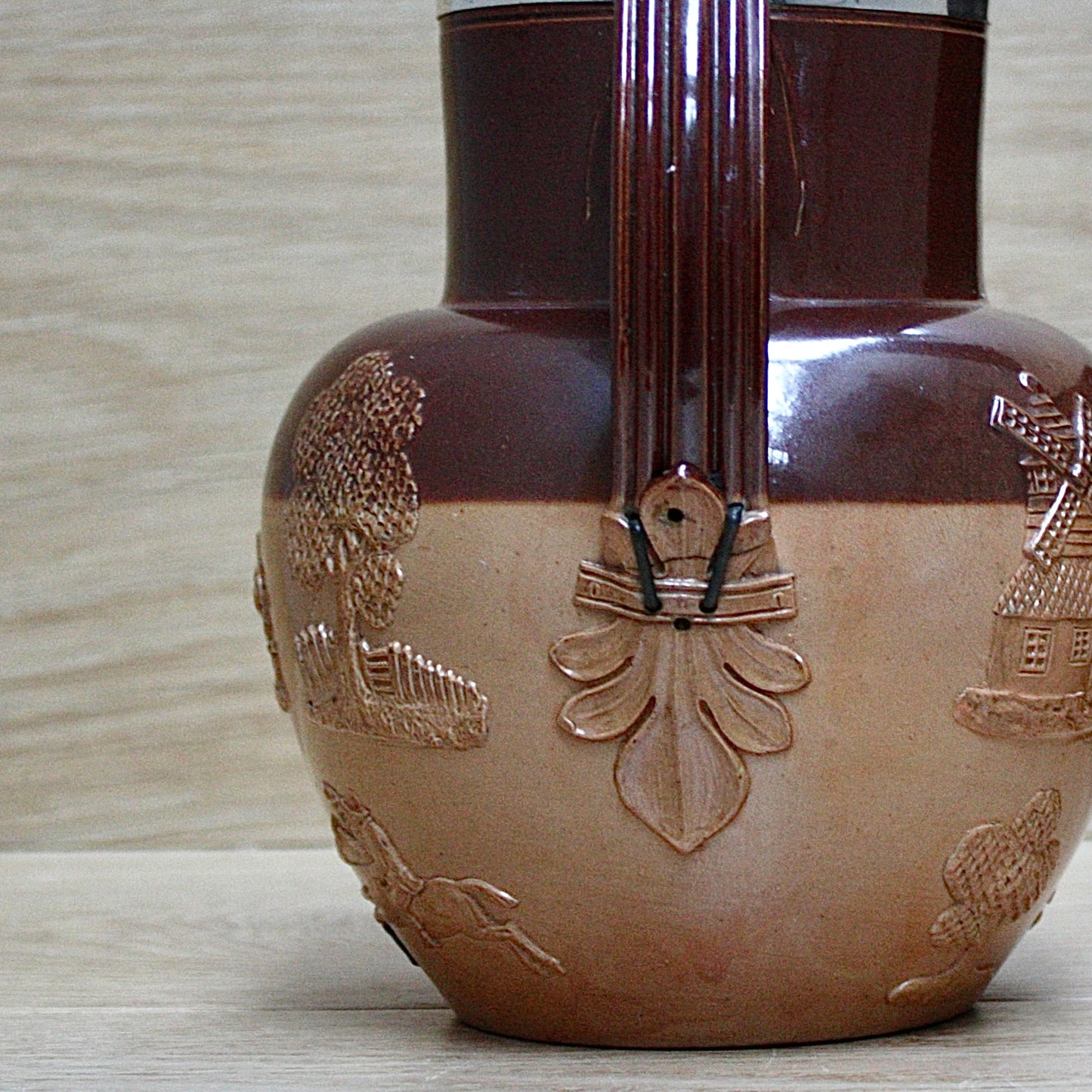 
                  
                    a splendid staple and rivet repaired doulton of lambeth "harvest" jug
                  
                