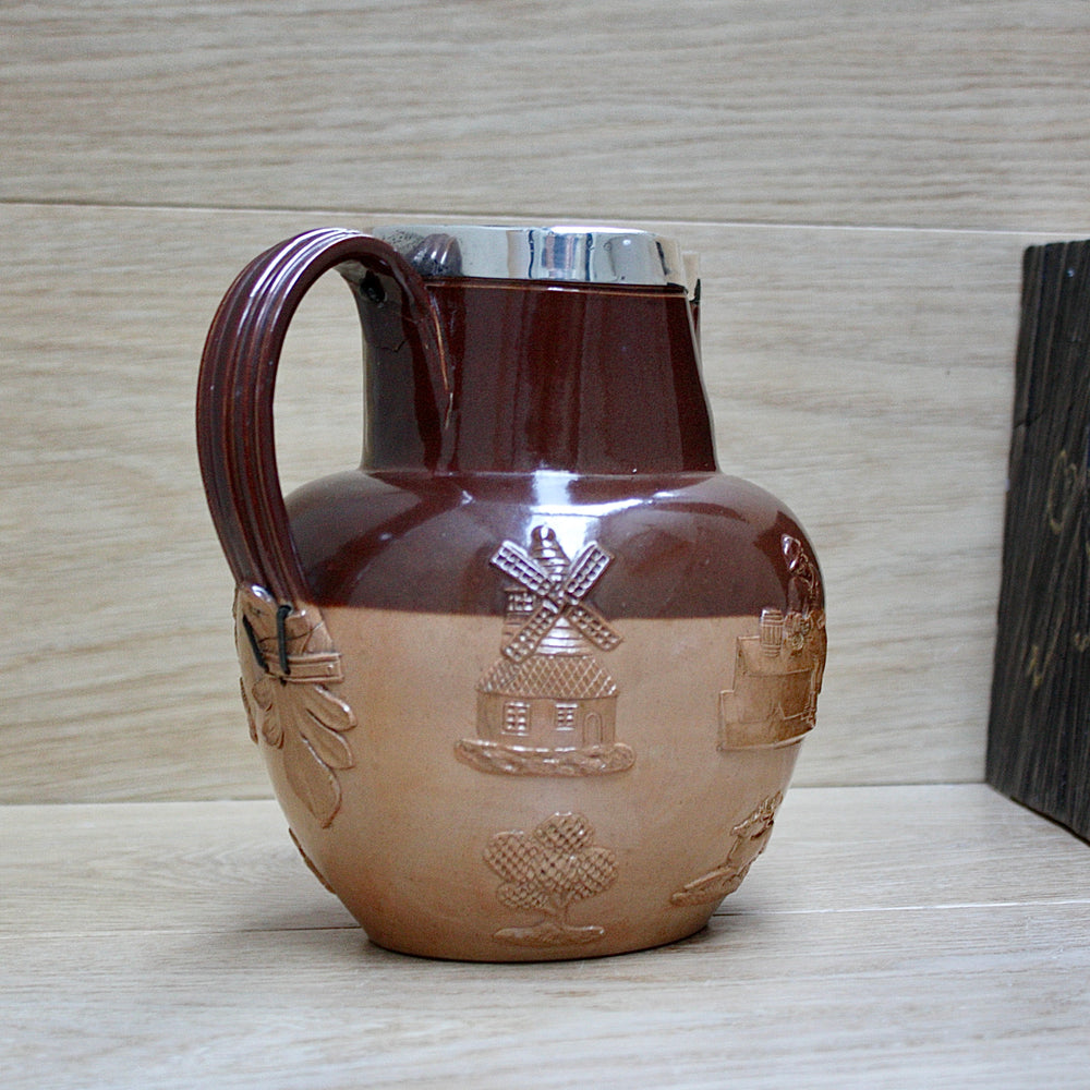 
                  
                    a splendid staple and rivet repaired doulton of lambeth "harvest" jug
                  
                