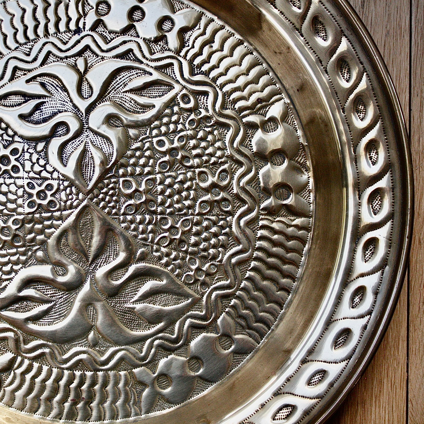 
                  
                    an intricately designed embossed charger from old calabar.
                  
                