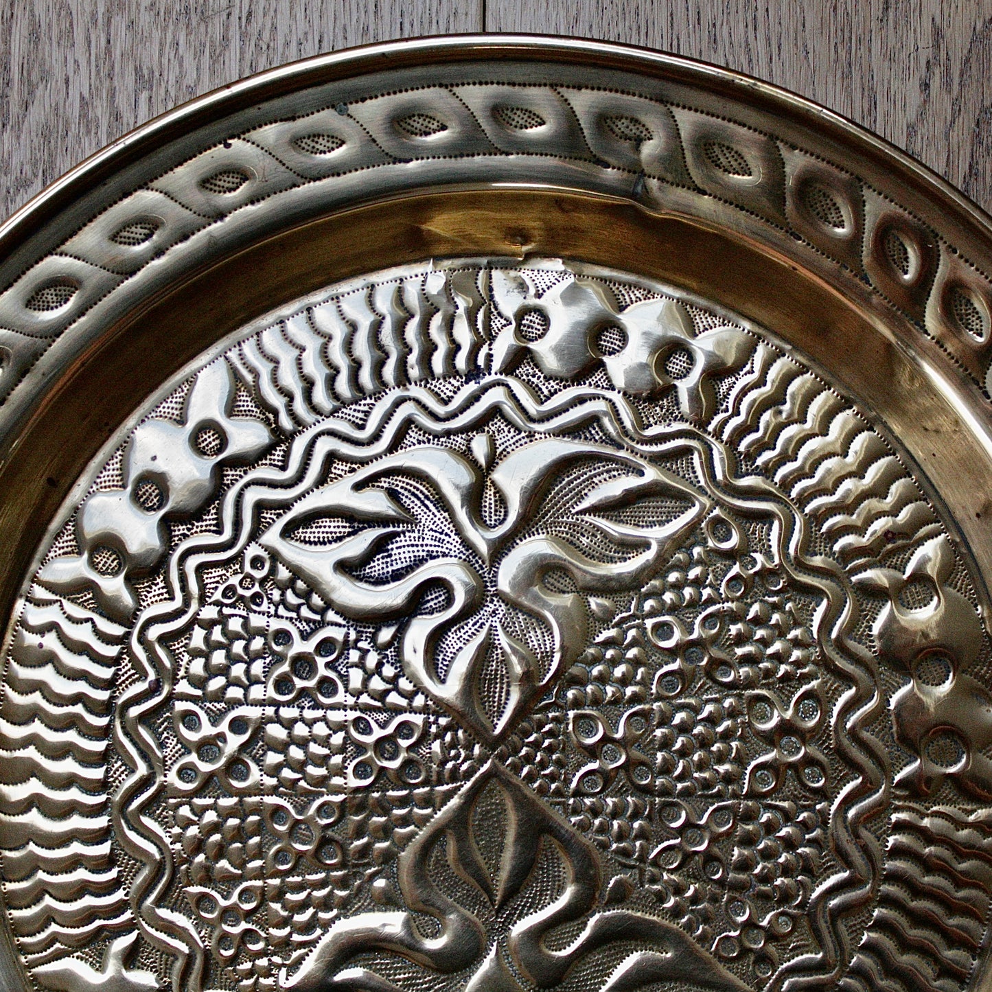 
                  
                    an intricately designed embossed charger from old calabar.
                  
                